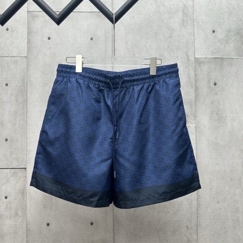 GUCCI Printed technical poplin swim shorts in navy