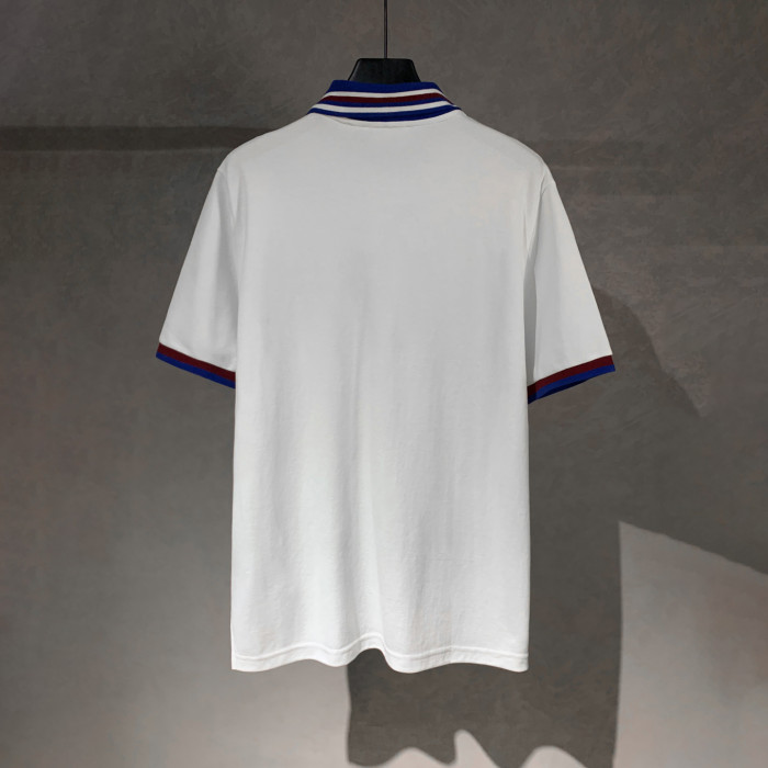 Gucci Cotton piquet polo shirt with intarsia in ivory and blue