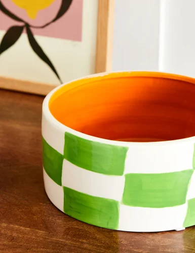Green and orange checkerboard pattern decorated bowl