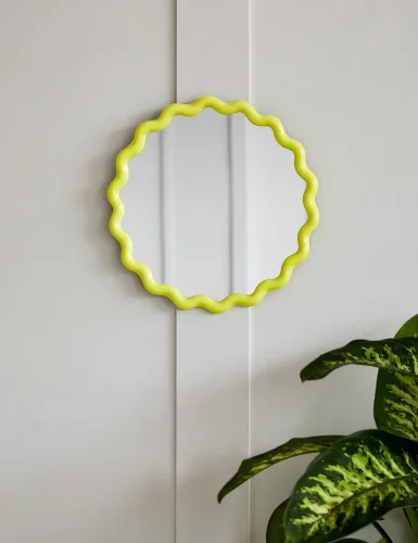 Small round yellow wave mirror