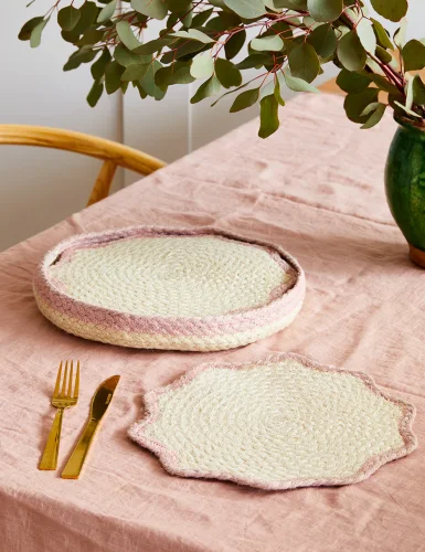 A set of 6 shell pink blush placemats