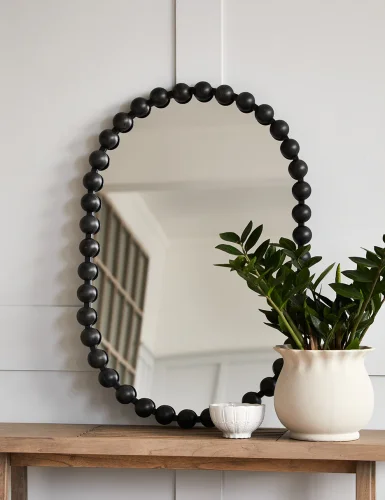 Oval black spherical mirror