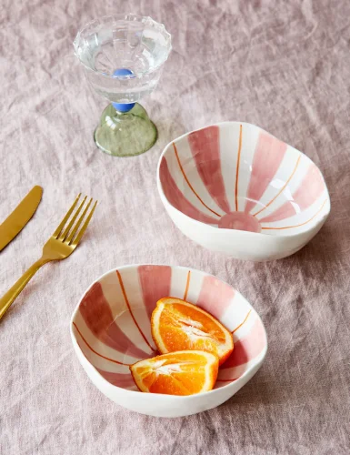 2 bowls with white and pink abstract shapes