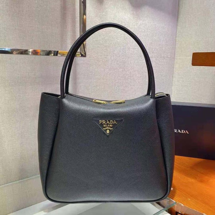 Prada Women Medium Leather Handbag with the Prada Metal Lettering Logo Illuminating Its Center-Black