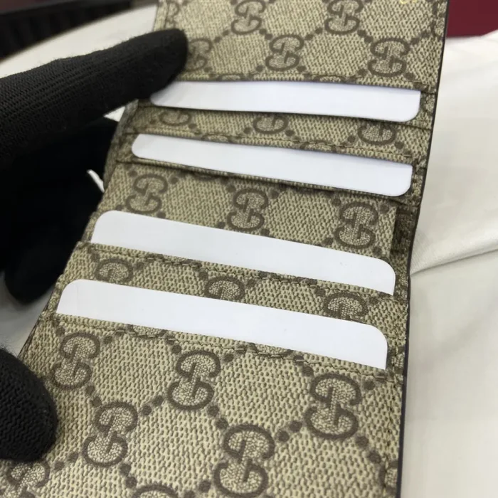 Gucci Unisex GG Emblem Bi Fold Embossed Wallet-Brown