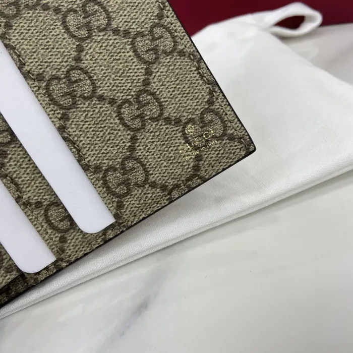 Gucci Unisex GG Emblem Bi Fold Embossed Wallet-Brown