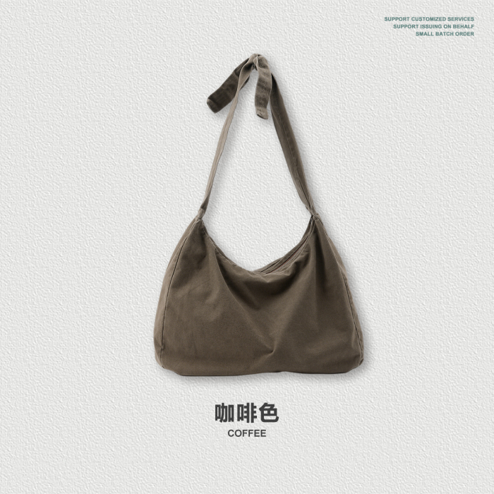 Retro-style washed and tied twill crossbody bag, suitable for commuting and heavy-duty shoulder crossbody use.