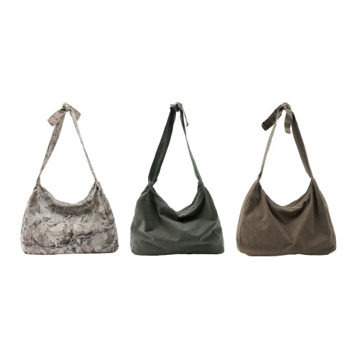 Retro-style washed and tied twill crossbody bag, suitable for commuting and heavy-duty shoulder crossbody use.