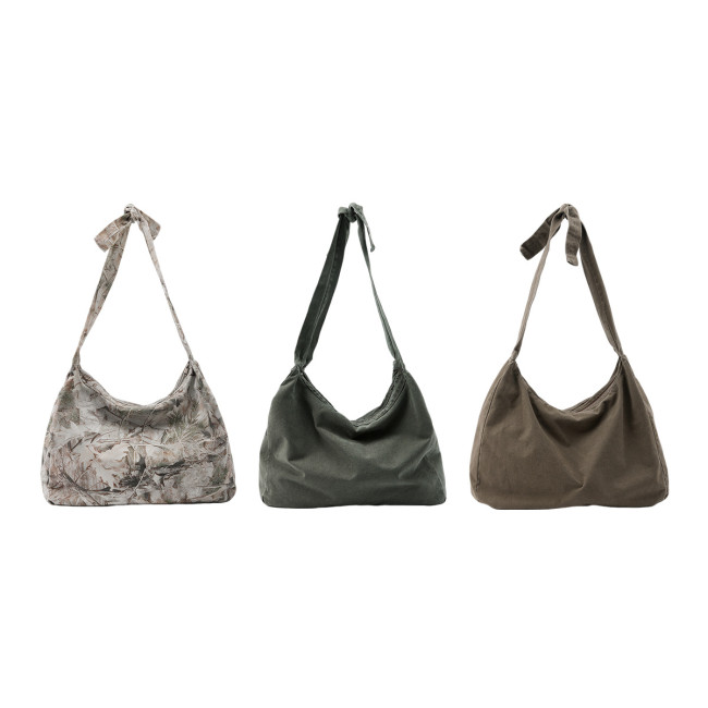 Retro-style washed and tied twill crossbody bag, suitable for commuting and heavy-duty shoulder crossbody use.