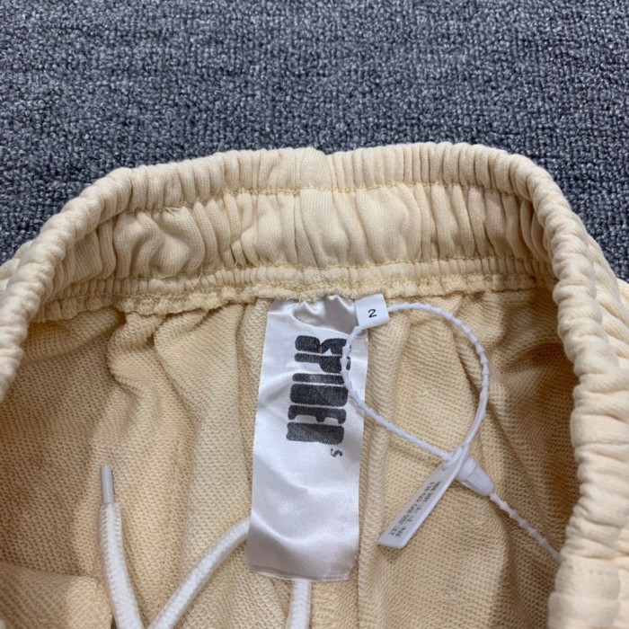 Young Thug Sp5der White lettering beige pants