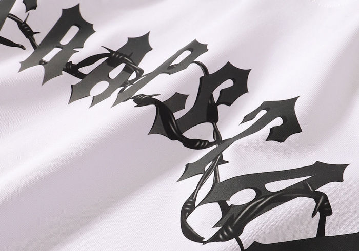Gradient letters with thorns pattern tee