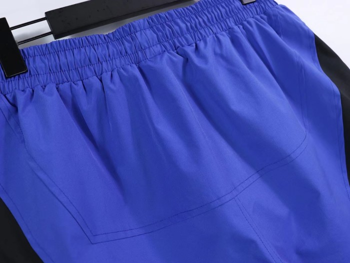 Men's logo printed letters side color blocking sports shorts