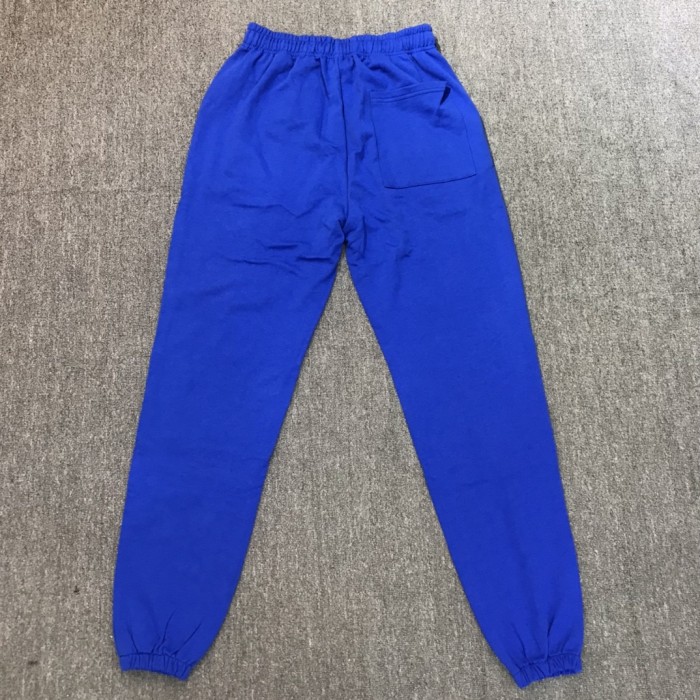 Left leg yellow monogrammed pants