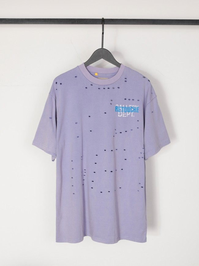 Lots of ripped blue and white letters overlapping Tee