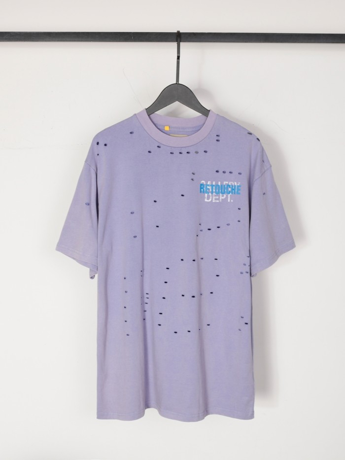Lots of ripped blue and white letters overlapping Tee