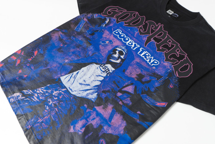 Godspeed Trap Hip Hop Streetwear Front Pink Outline Gothic Script Hooded Skeleton Man Purple Grain Background Booby Trap Text Graphic T-Shirt 29354631